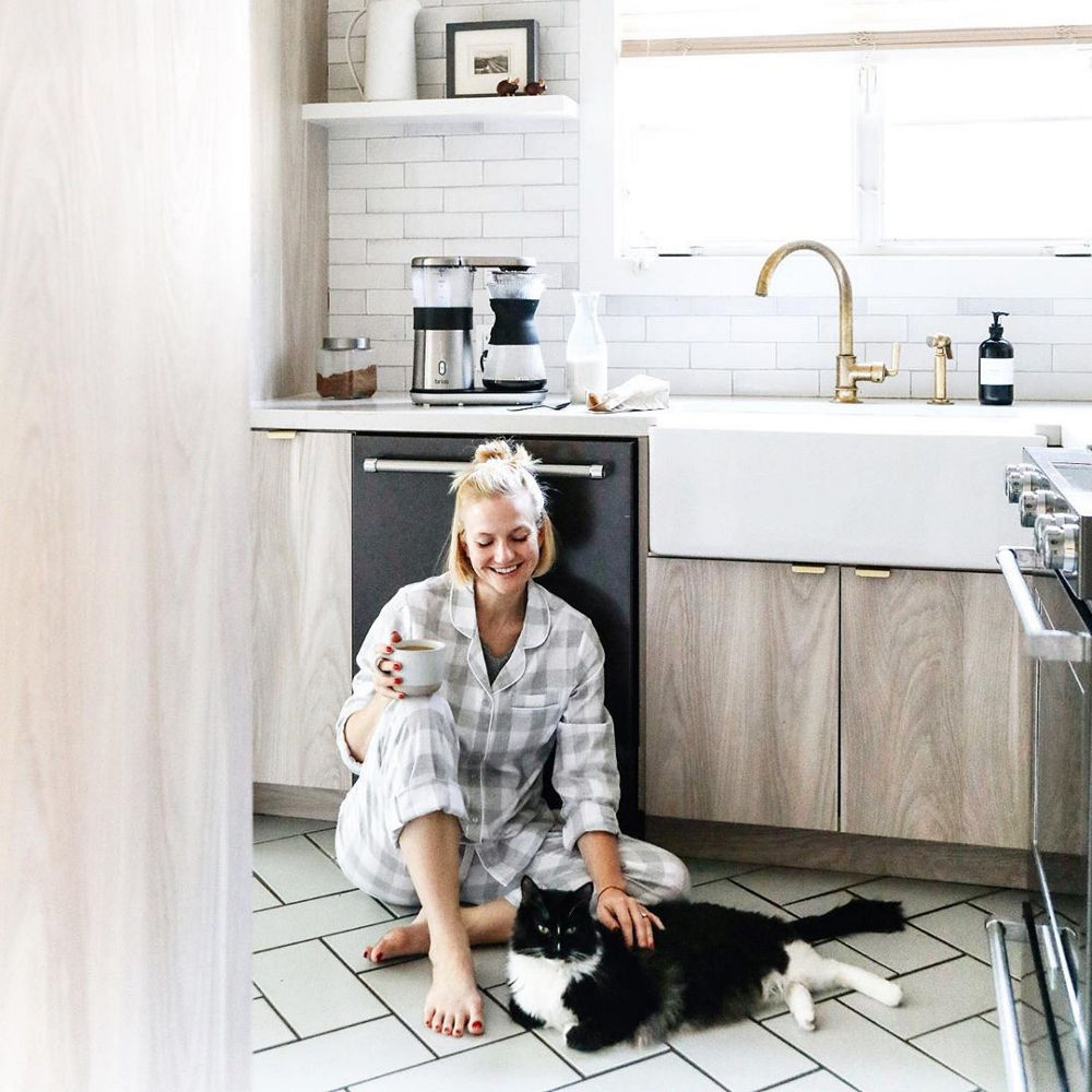 Anna Sage in her newly renovated kitchen featuring Ella Matte™ quartz countertops.