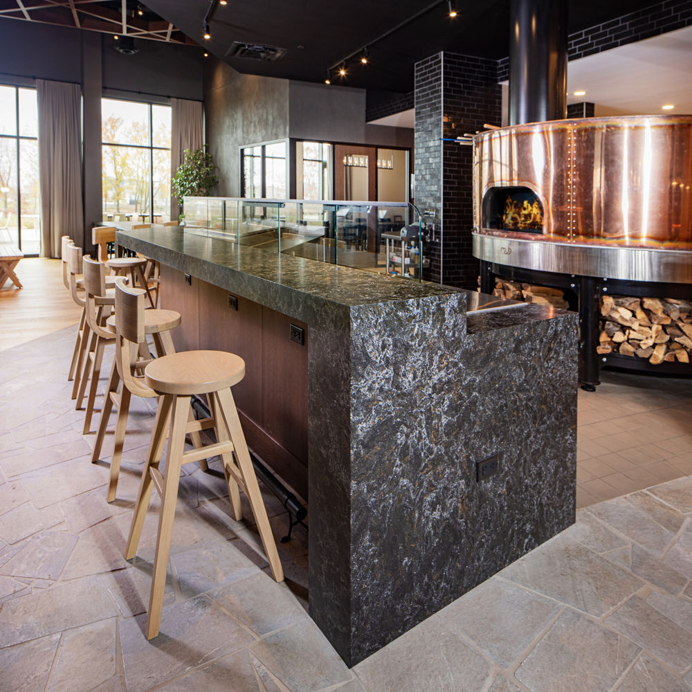 A pizza grille island featuring Cambria Armitage Matte quartz countertops and siding.