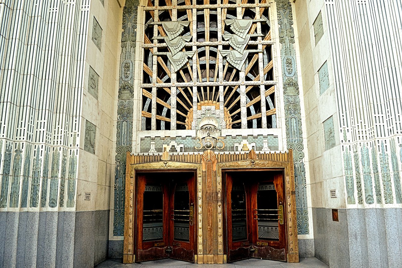 An ornate art deco styled high rise building entrance