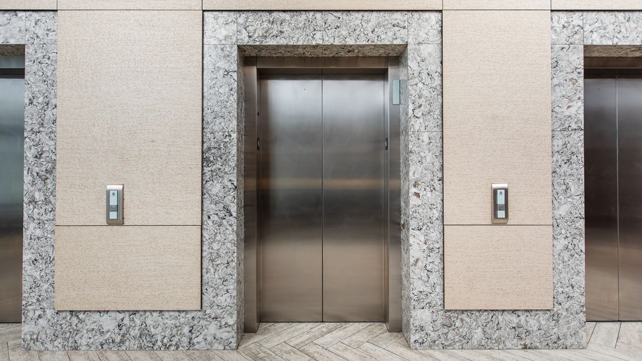 Elevators at the Embassy Suites, College Station trimmed with white quartz countertops.