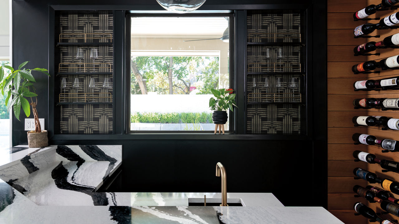 A bar-top made from white and black veined quartz countertops.