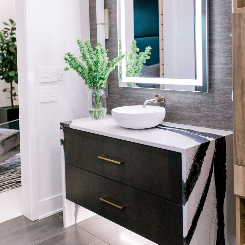 A vanity above a cabinet with a Cambria Bentley quartz countertop and siding.