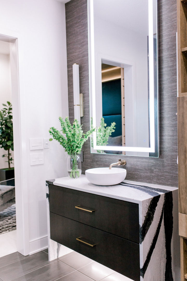 A vanity above a cabinet with a Cambria Bentley quartz countertop and siding.