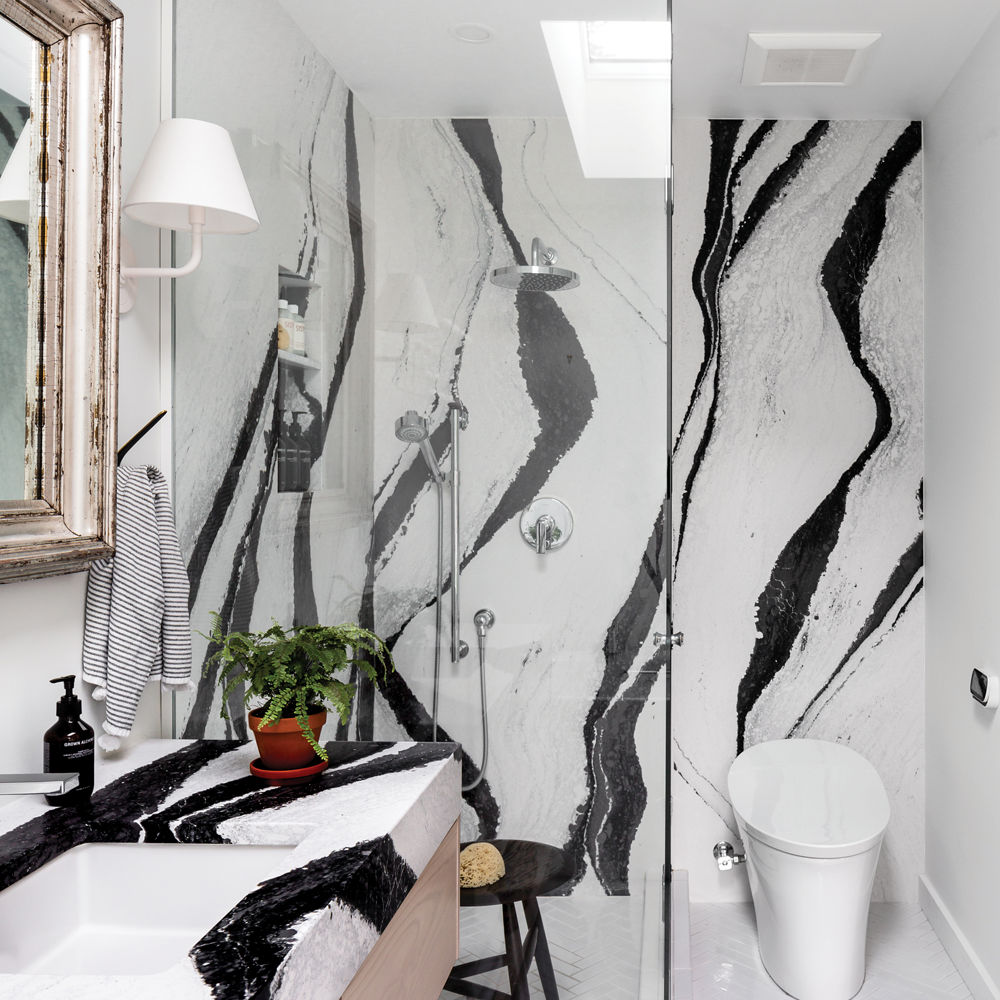 Shower walls in floor-to-ceiling Cambria Bentley quartz design