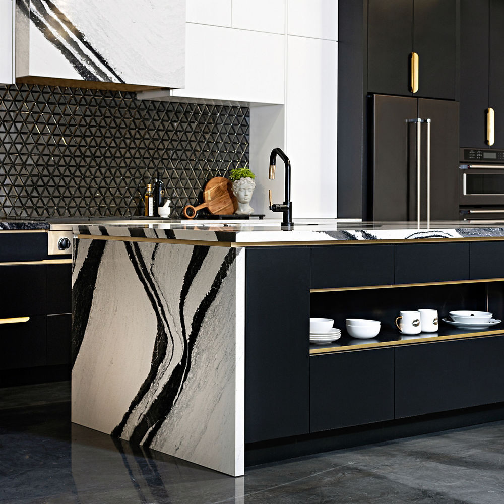 Kitchen featuring a counter and island with Cambria Bentley quartz countertops.