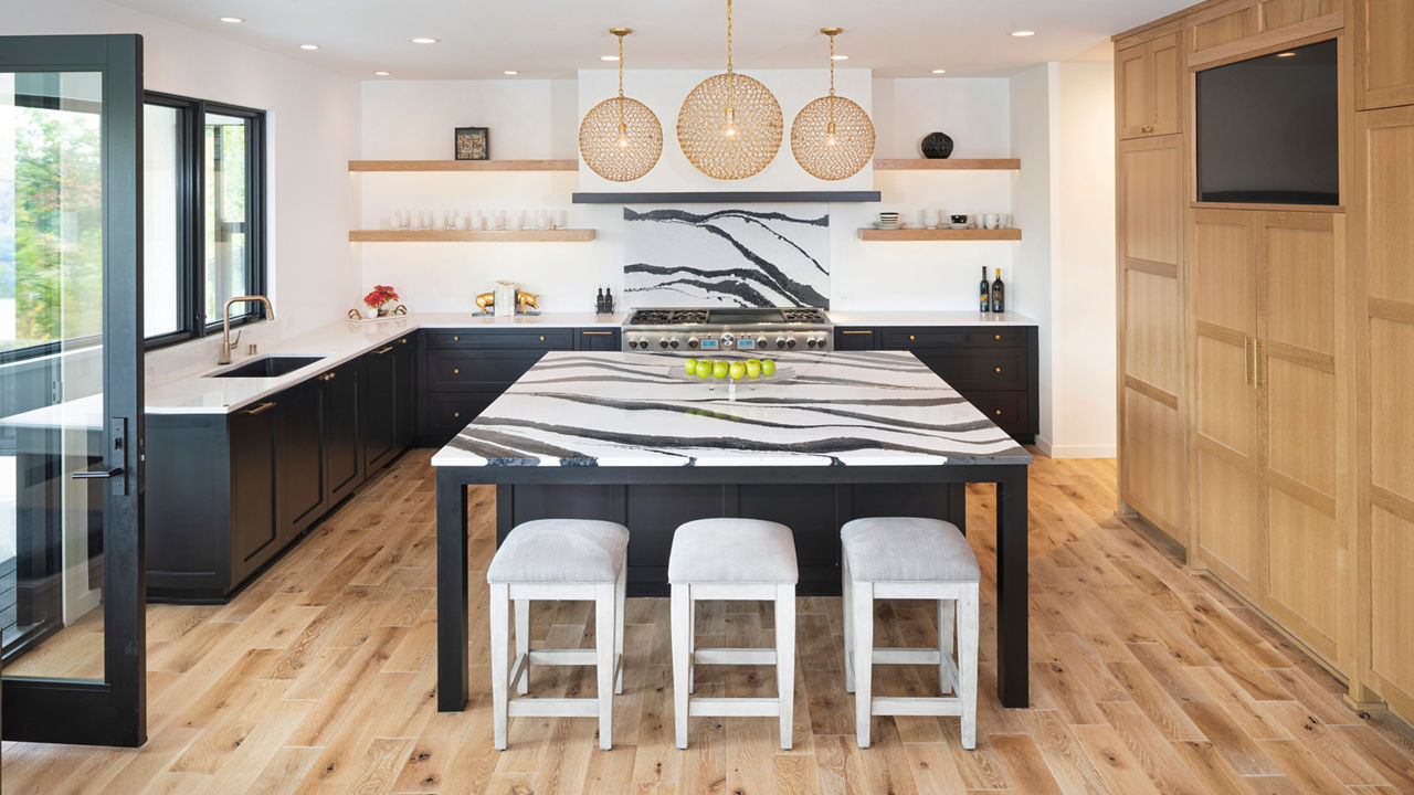 Cambria Bentley and Torquay quartz countertops and backsplash in a bold, unique kitchen.