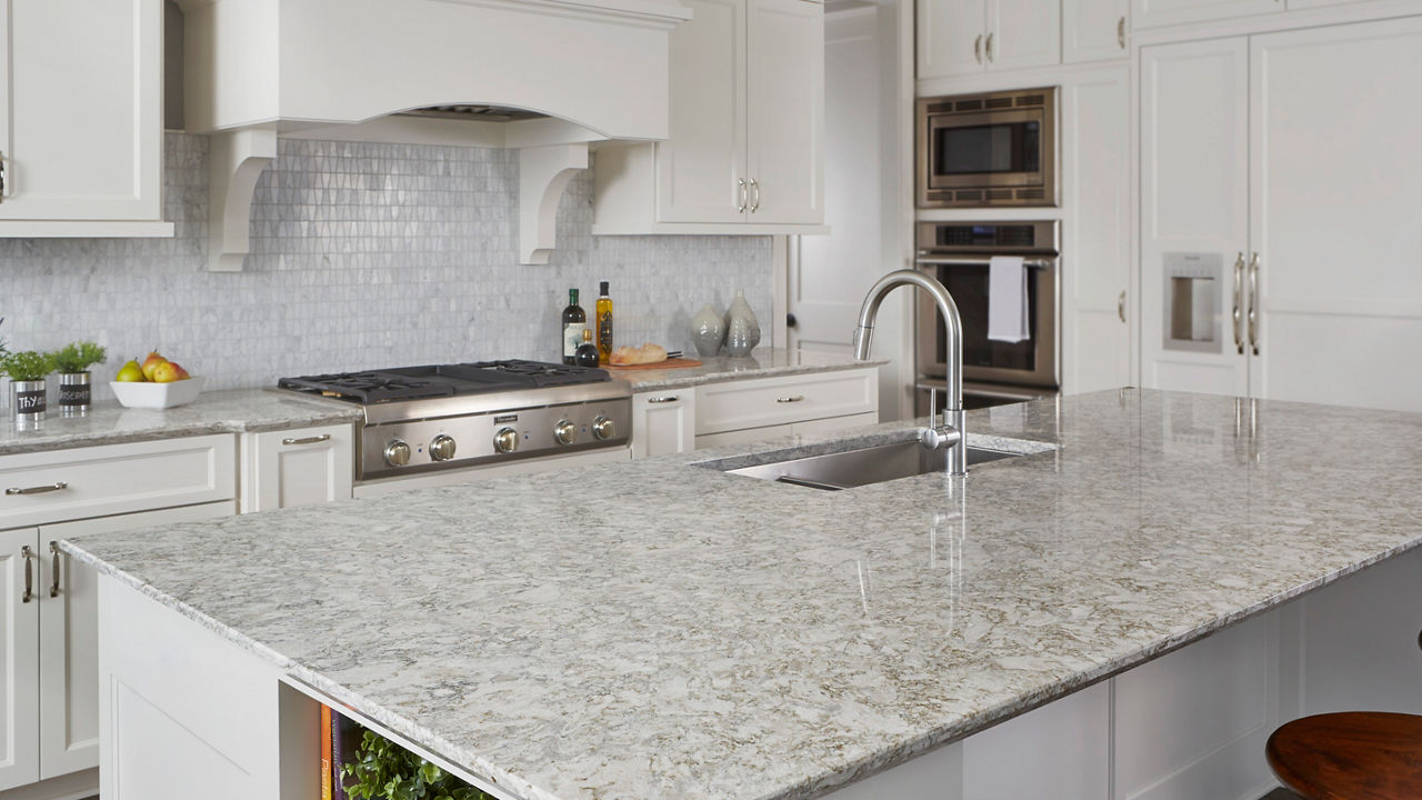 Light kitchen with tile backsplash featuring Berwyn Cambria quartz countertops