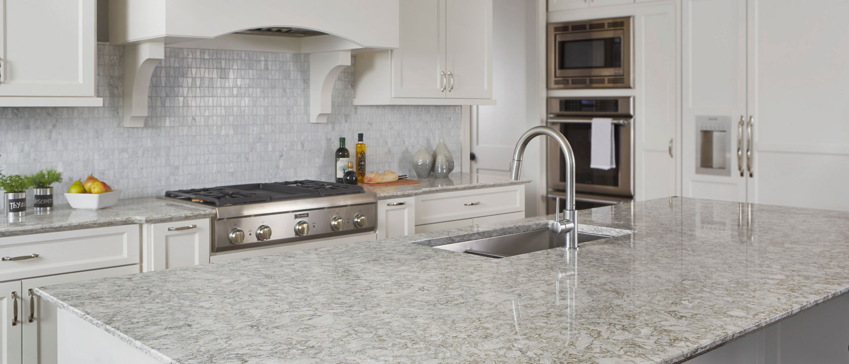 Light kitchen with tile backsplash featuring Berwyn Cambria quartz countertops