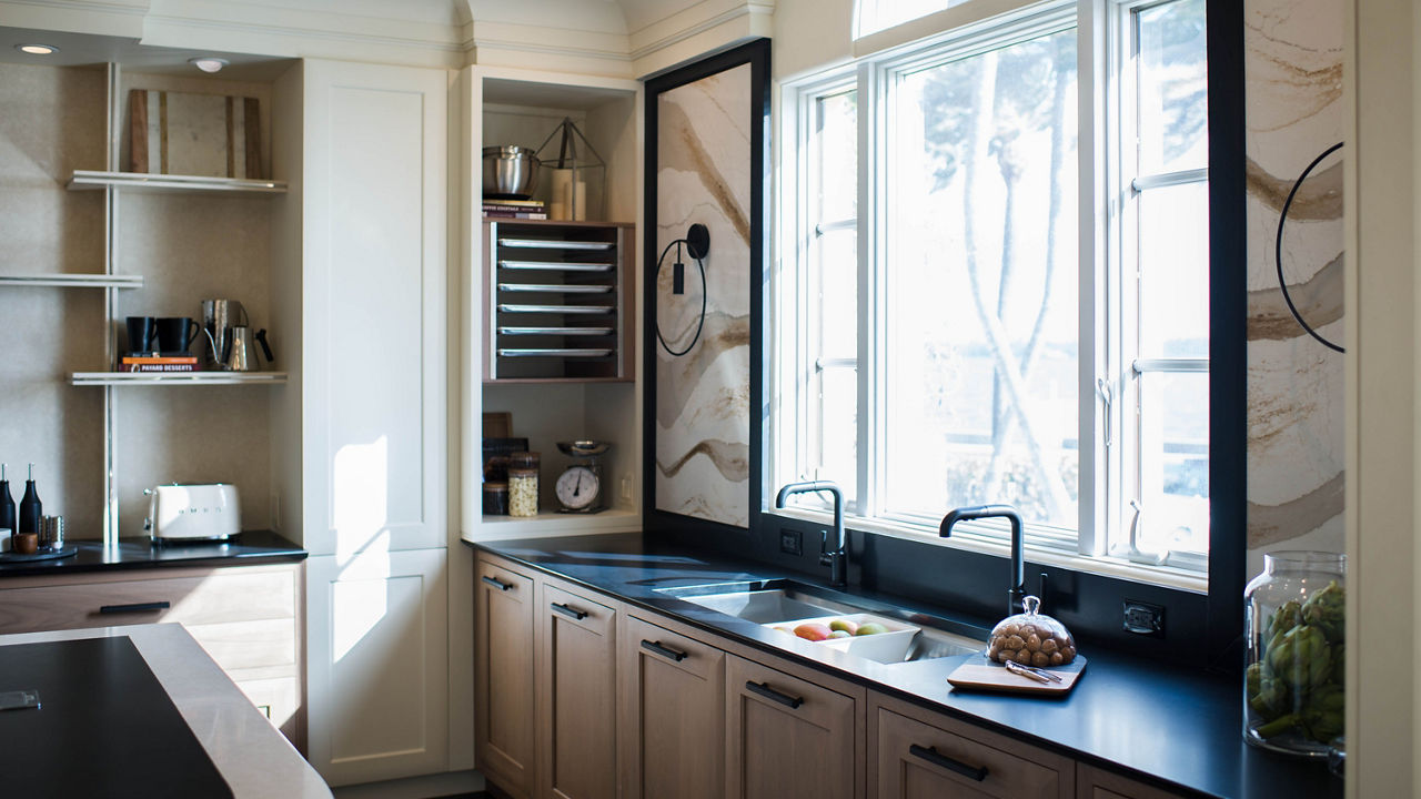 Kitchen featuring a commercial rack that stores baking sheets beside a Cambria Plackpool Matte quartz counter.