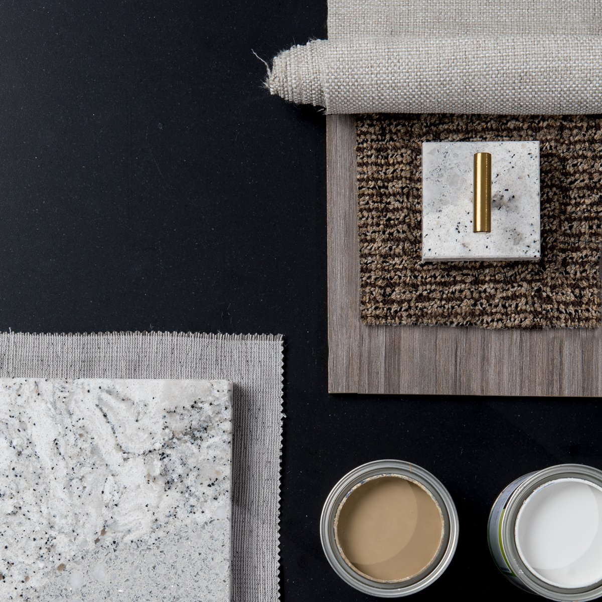 A moodboard featuring a Cambria Blackpool Matte quartz countertop with a wood panel, two candles, and a slab of Cambria Summerhill quartz over a gray cloth.