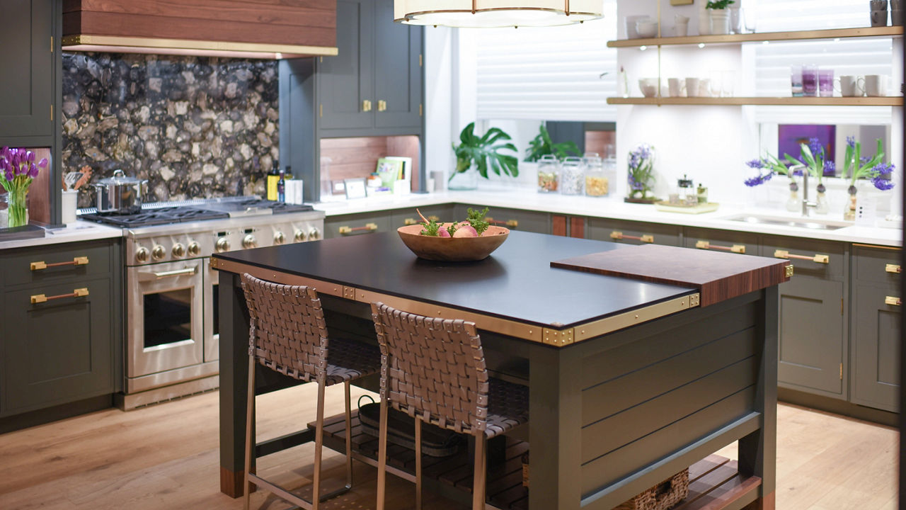 White and Black kitchen with floral accents and Blackpool Matte and White Cliff quartz countertops and island