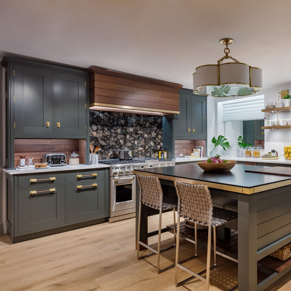 A dark toned kitchen with Blackpool Matte and White Cliff quartz countertops