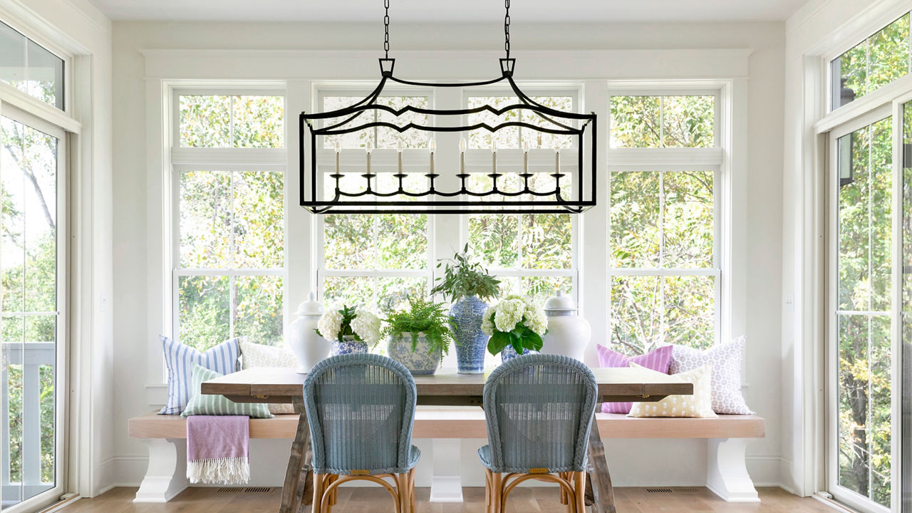 An open and airy dining room featuring the wood Olivia table