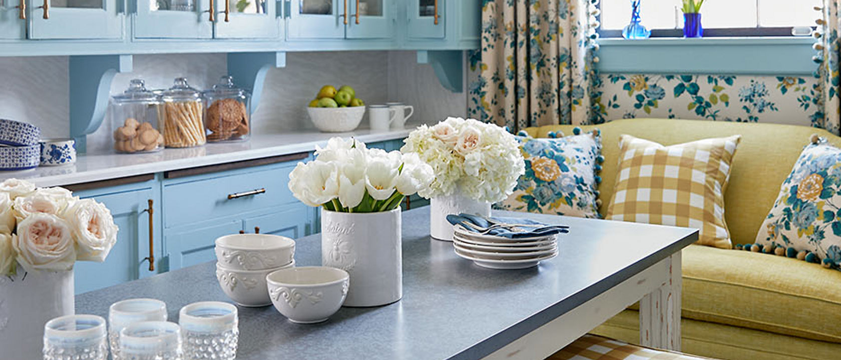 A blue mixed kitchen with a kitchen featuring a perimeter with Cambria Delgatie quartz.