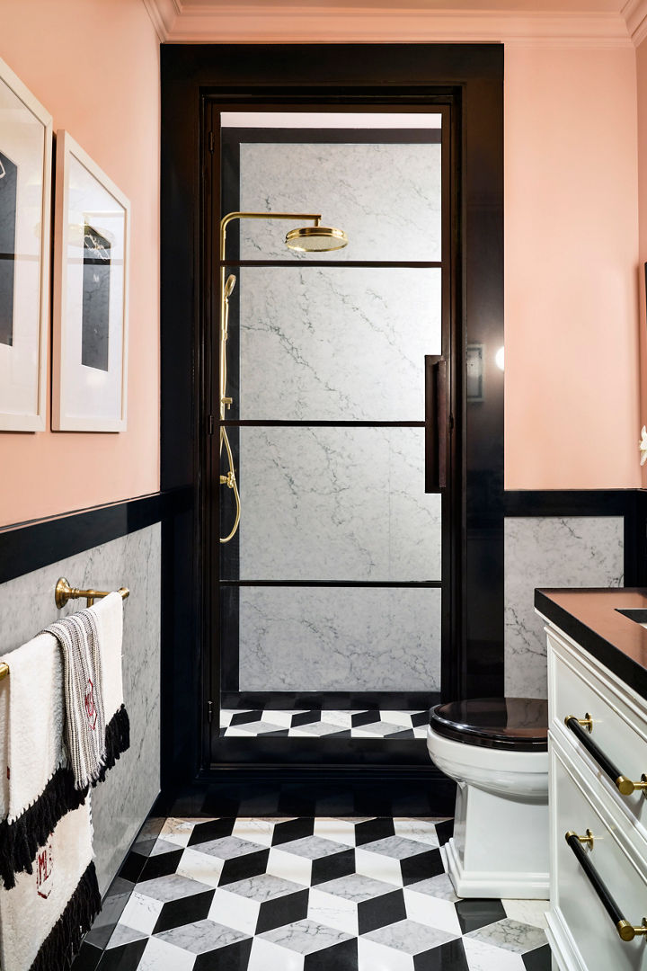 A sleek modern bathroom with Cambria Bridport shower walls and Cambria Black quartz countertop