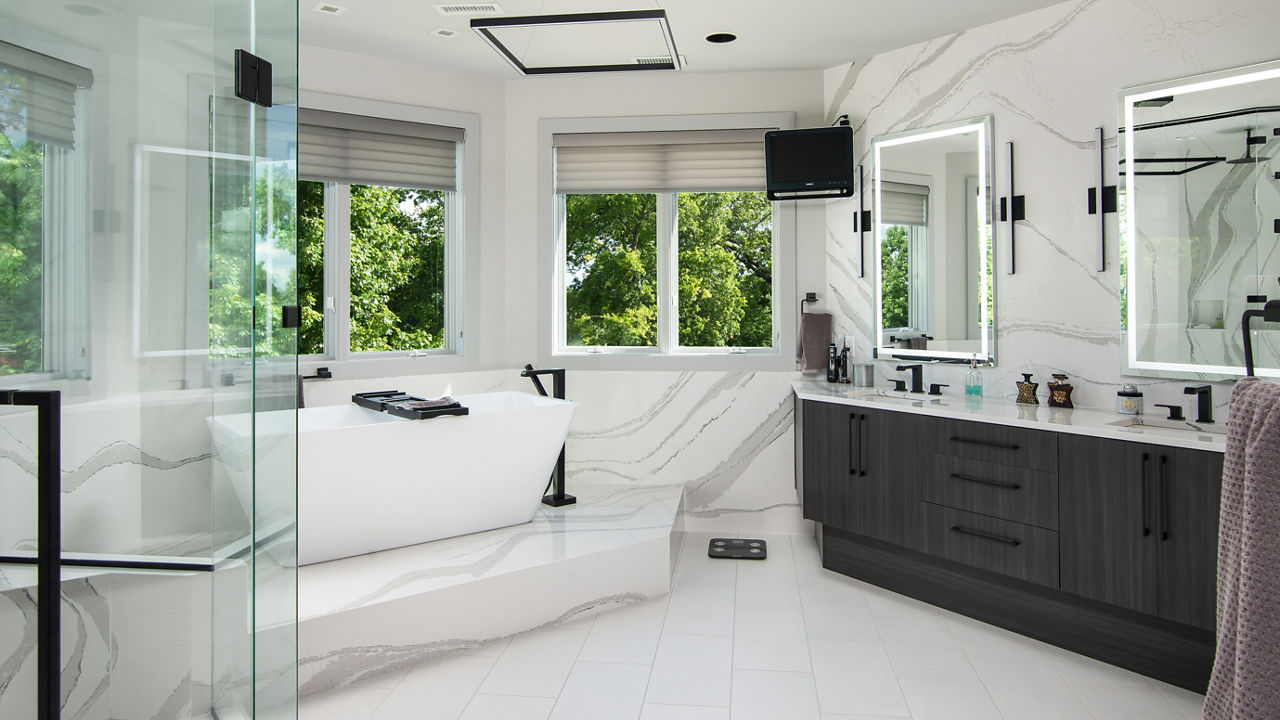 A bathroom with full-height Cambria Brittanicca quartz siding, countertops, and a platform underneath the bathtub.