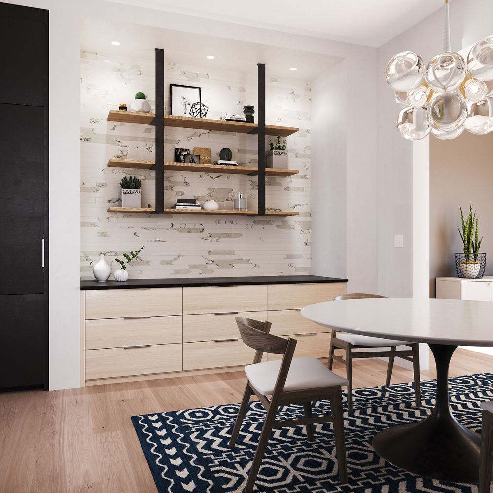 A dining room with a highlighted accent wall with Cambria Brittanicca Block quartz.