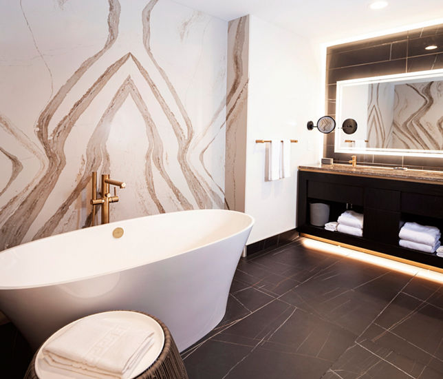 Brittanicca Gold Warm Quartz Design inside a bathroom at the Omni Viking Lakes Hotel.