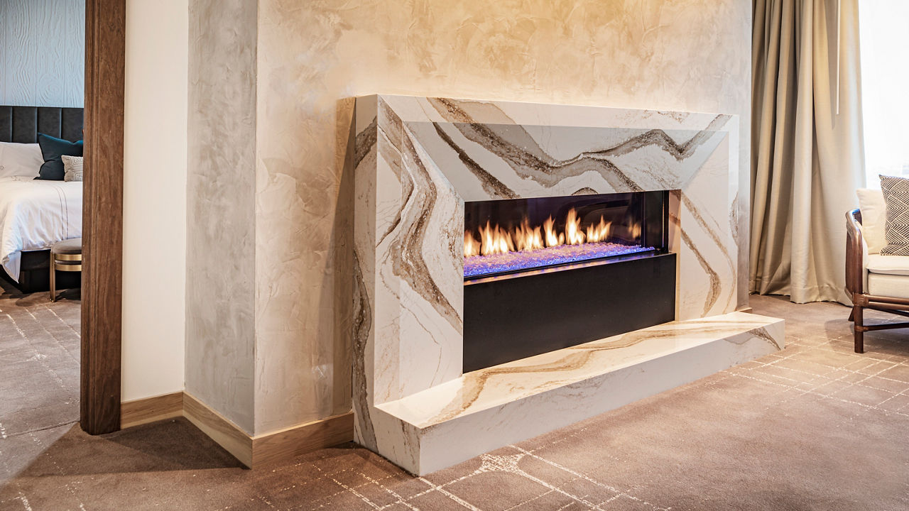 A Brittanicca Gold Warm fireplace surround