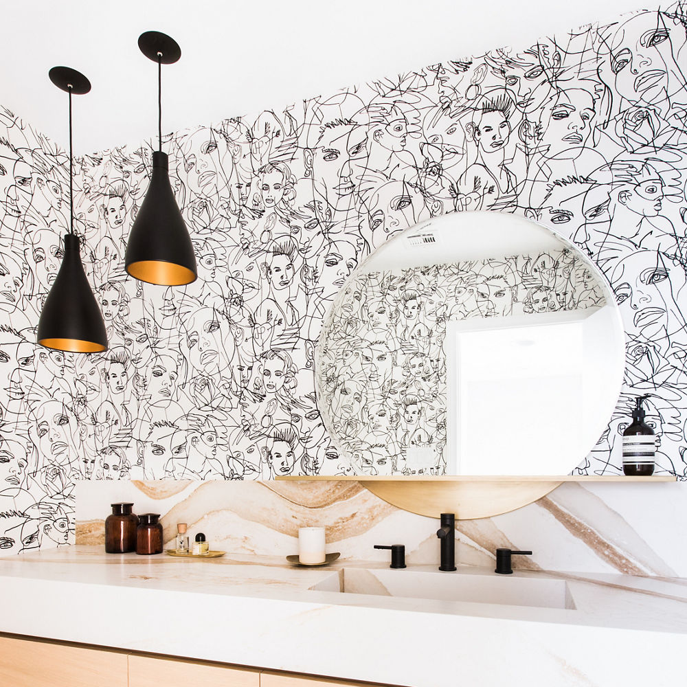 A stylish modern bathroom featuring  Cambria Brittanicca gold warm countertops