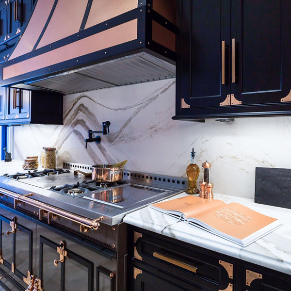 Cambria Brittanicca Gold Warm Matte quartz kitchen countertop and backsplash in kitchen designed by Vanessa DeLeon