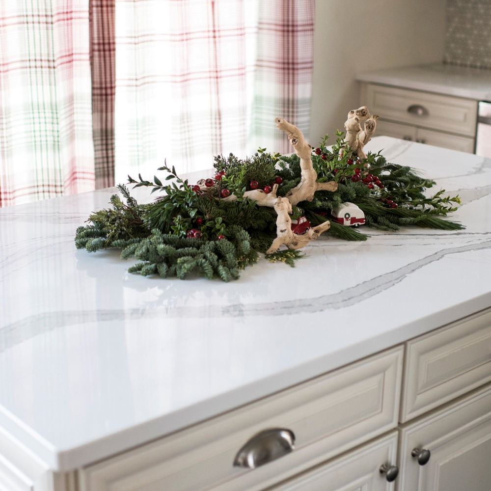 A Brittanicca quartz countertop with a holiday decoration on it