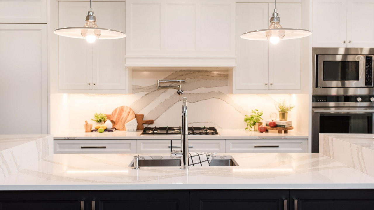 Kitchen featuring an island with Cambria Brittanicca quartz countertops.