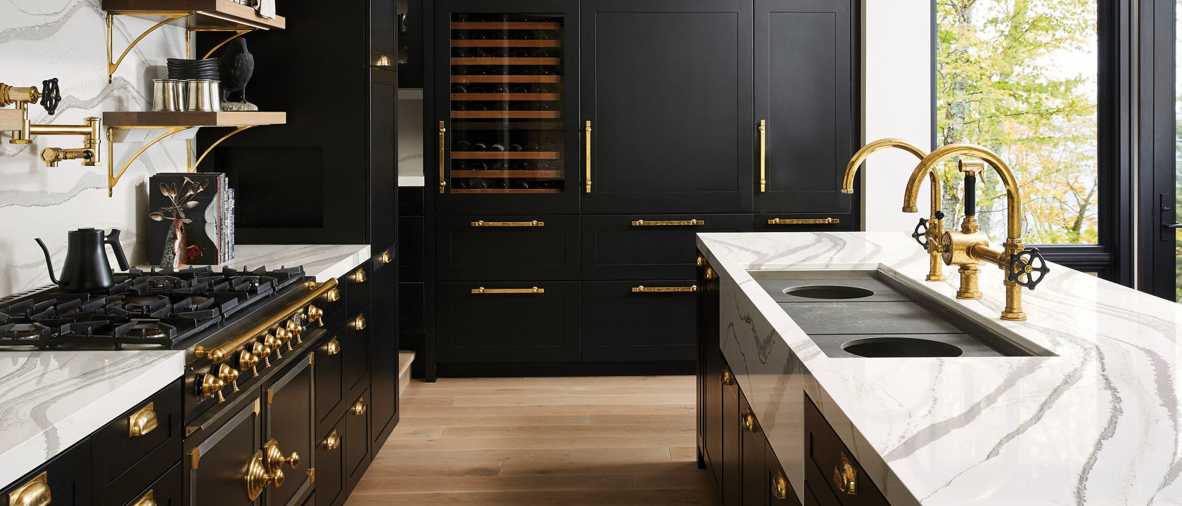 Kitchen featuring black cabinets and Brittanica quartz countertops.