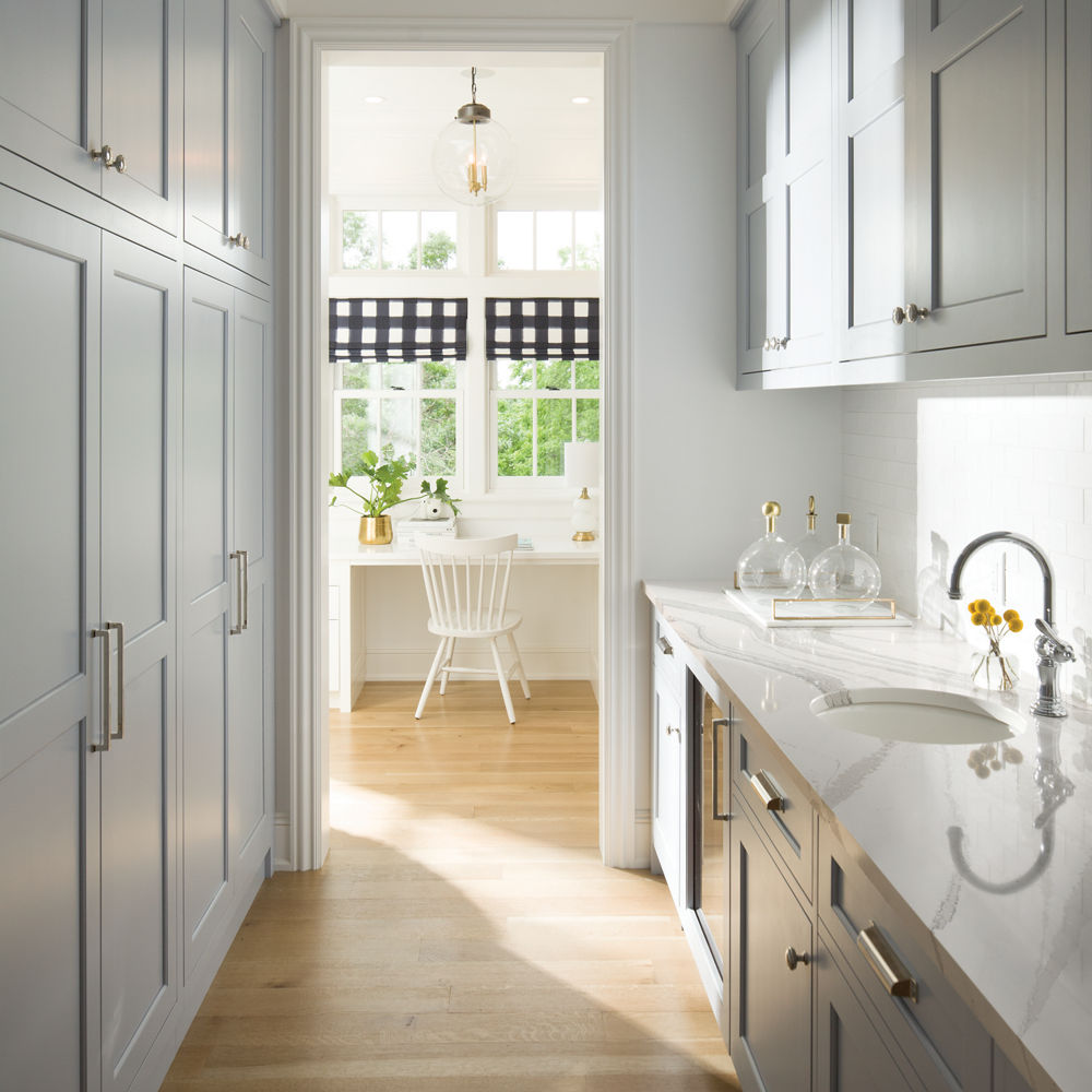 Sleek laundry room with Cambria Brittanicca quartz countertops