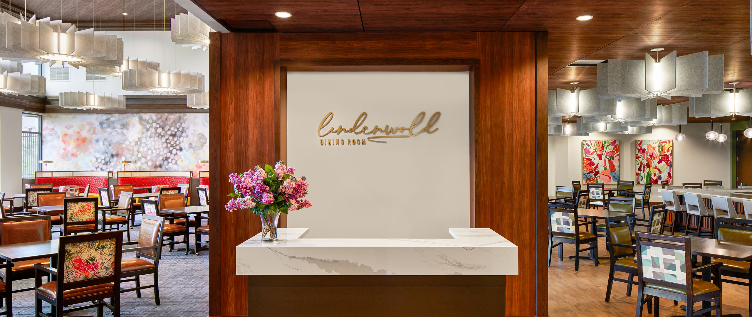 a cafeteria reception desk topped with white quartz countertops.