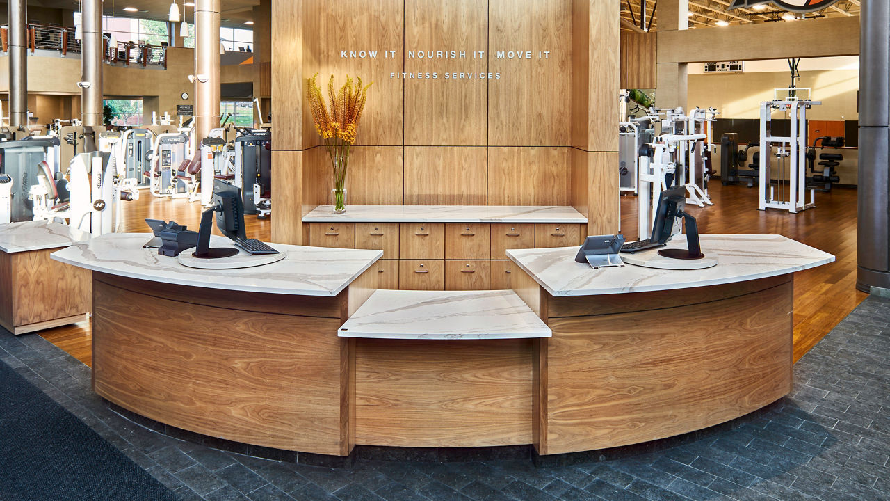 A Life Time Fitness reception desk in Flatirons, CO with Brittanicca quartz countertops