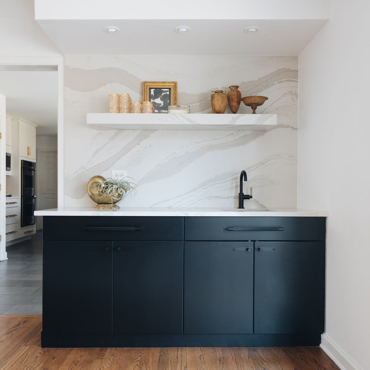 Cambria Brittanicca Warm Matte quartz on kitchen wall.