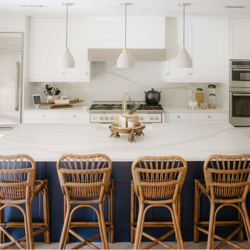 White and blue kitchen featuring Brittanicca Warm Matte from THE HIP SUBURBAN.