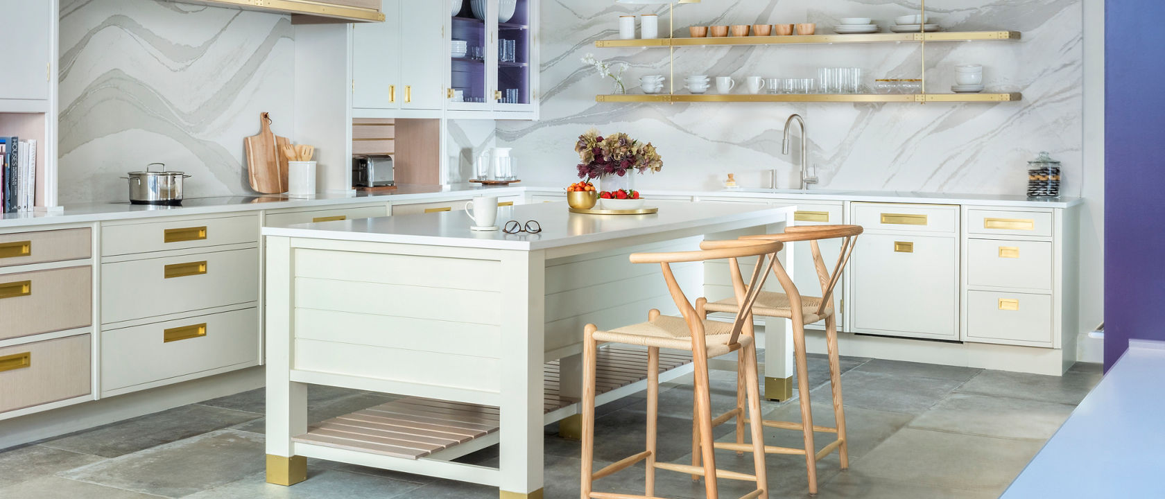 Christopher Peacock's Boston showroom installation adorned in Cambria's White Cliff Matte countertops and Brittanicca Warm Matte backsplash.