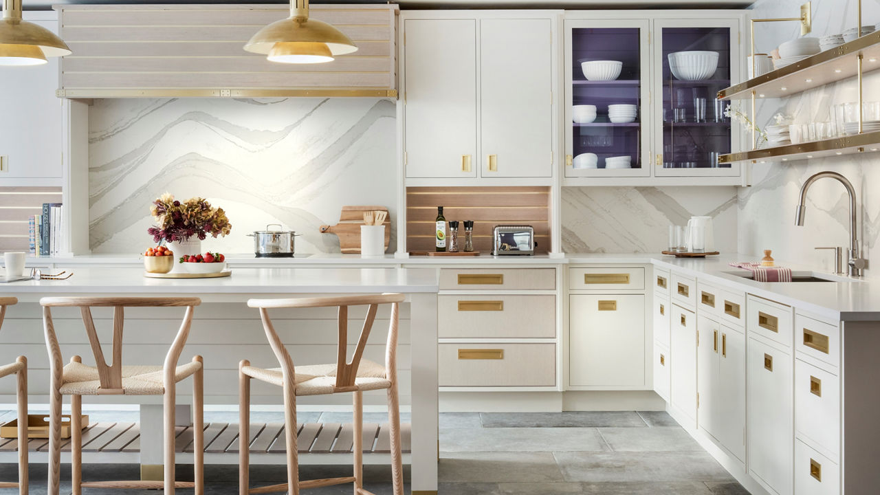 Kitchen with enlivened walls with a streamlined style featuring Cambria Brittanicca Warm Matte countertops.