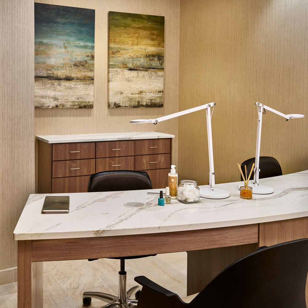 A Brittanicca Warm quartz tabletop in the Life Time Fitness Spa