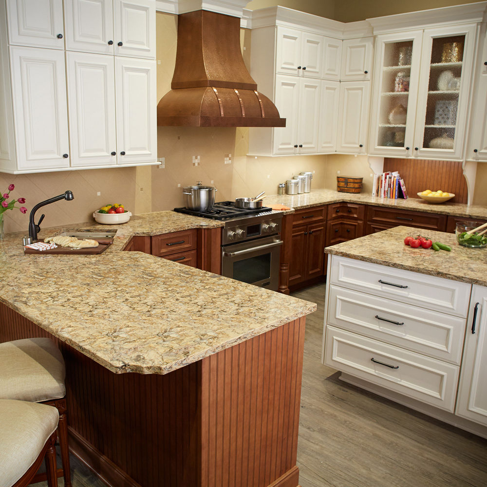 A kitchen with white cabinets and Buckingham quartz countertops