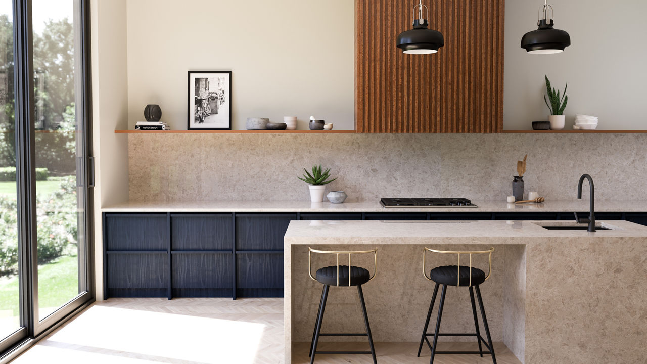 Kitchen beside a sliding door outside with a beige backsplash, island, and flooring.