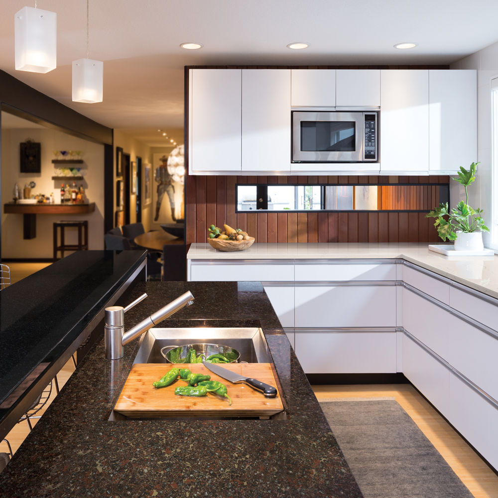 A sleek modern kitchen design with Cambria Black, Hamilton, and Ella 