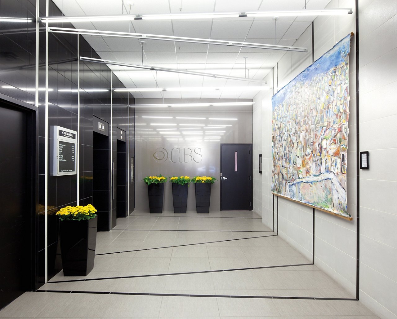 A CBS Radio lobby in Minneapolis, MN with Cambria Black and Whitehall quartz walls