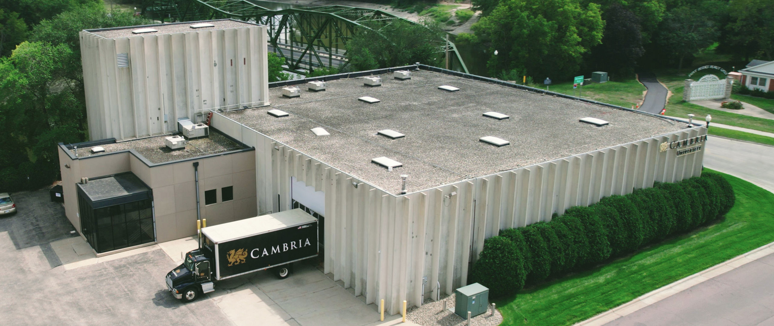 The back of Cambria University including a Cambria truck at the loading dock