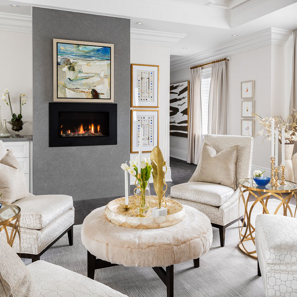 a traditional living room with a modern gray quartz fireplaces.