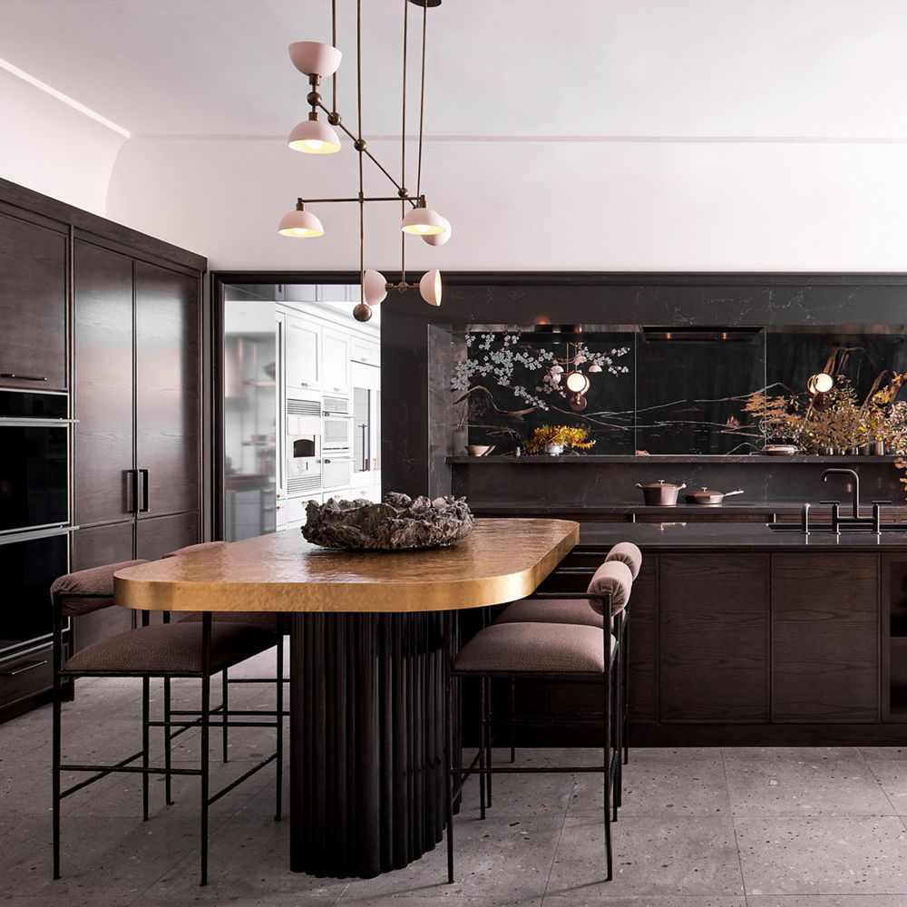 A dark and sleek modern kitchen with dark oak cabinets, tile flooring, Charlestown quartz countertops, column refrigerator, stacked ovens and a wooden dining table with plush seating and gorgeous modern light fixture above. 