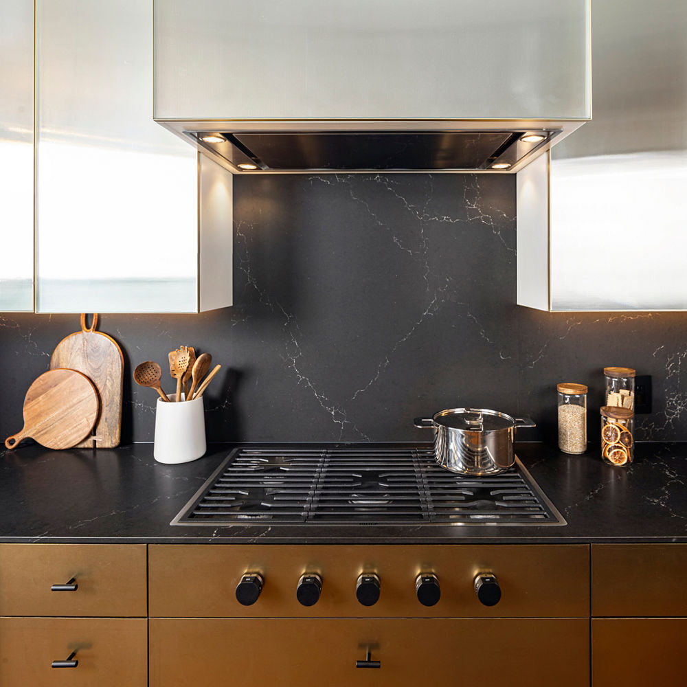 Cambria Charlestown quartz backsplash behind kitchen oven range