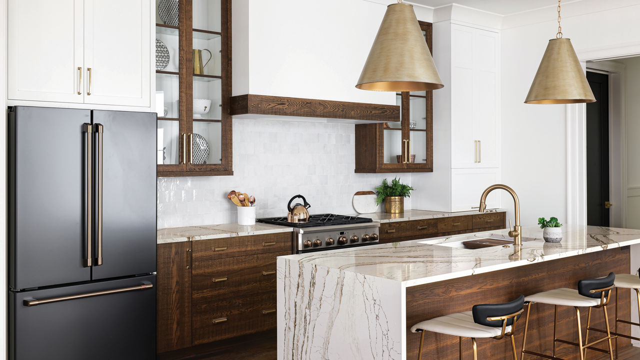 Copper-and-brown-veined Cambria Clovelly quartz countertops in a kitchen.