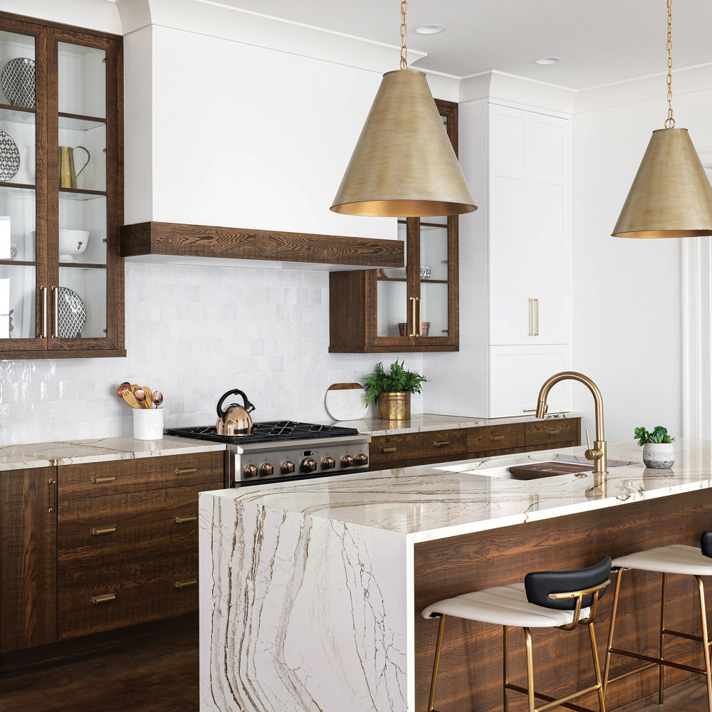 Copper-and-brown-veined Cambria Clovelly quartz countertops in a kitchen.