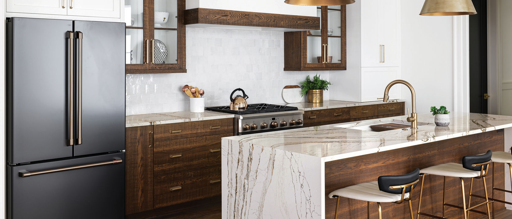 Copper-and-brown-veined Cambria Clovelly quartz countertops in a kitchen.
