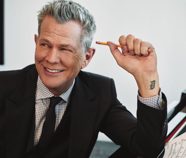 A portrait of David Foster.