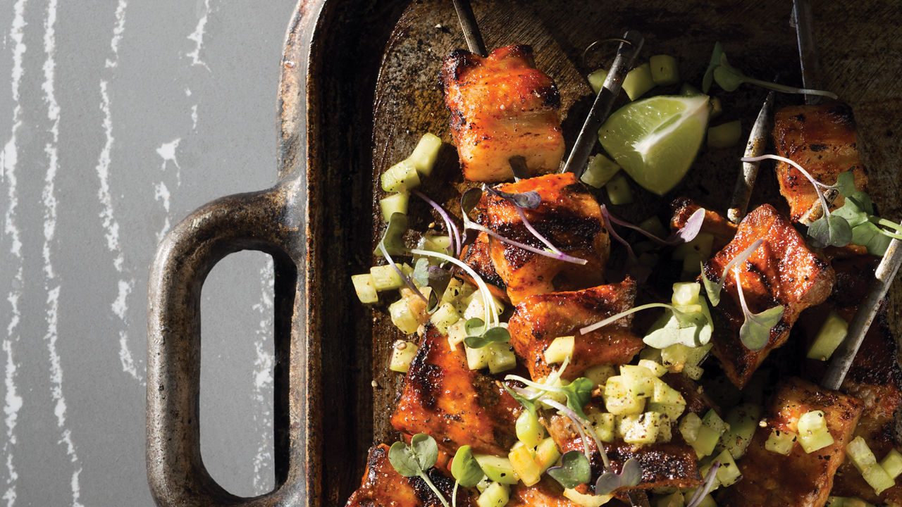 Pork belly skewers on top of Cambria Queen Anne™.