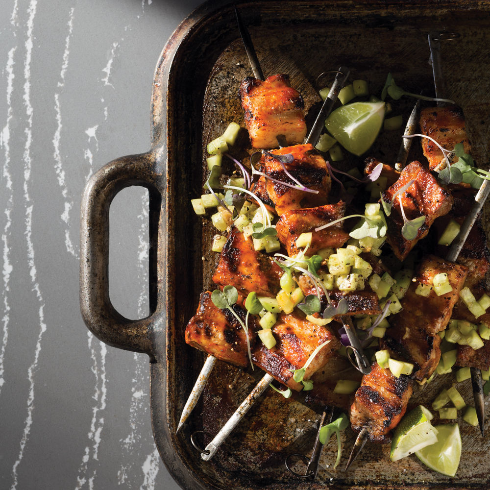 Pork belly skewers on top of Cambria Queen Anne™.